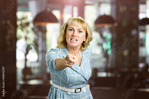 Quadro em tela Unhappy yelling woman, blurred background