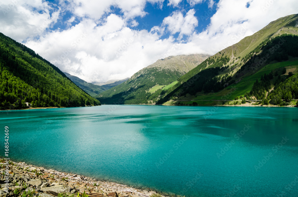 Landscape with lake and small spiaggetta lawn of the Trentino Alto Adige.