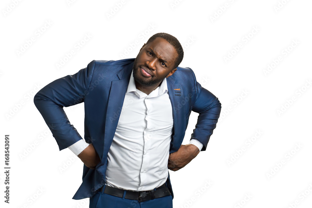 Businesman holding his hands on belt. Executive director with control glance. Executive director with control glance on white background. Businesman holding his hands on belt. Executive director with control glance. Executive director with control glance on white background.