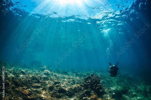 Sun beams of to reef with Scuba diver