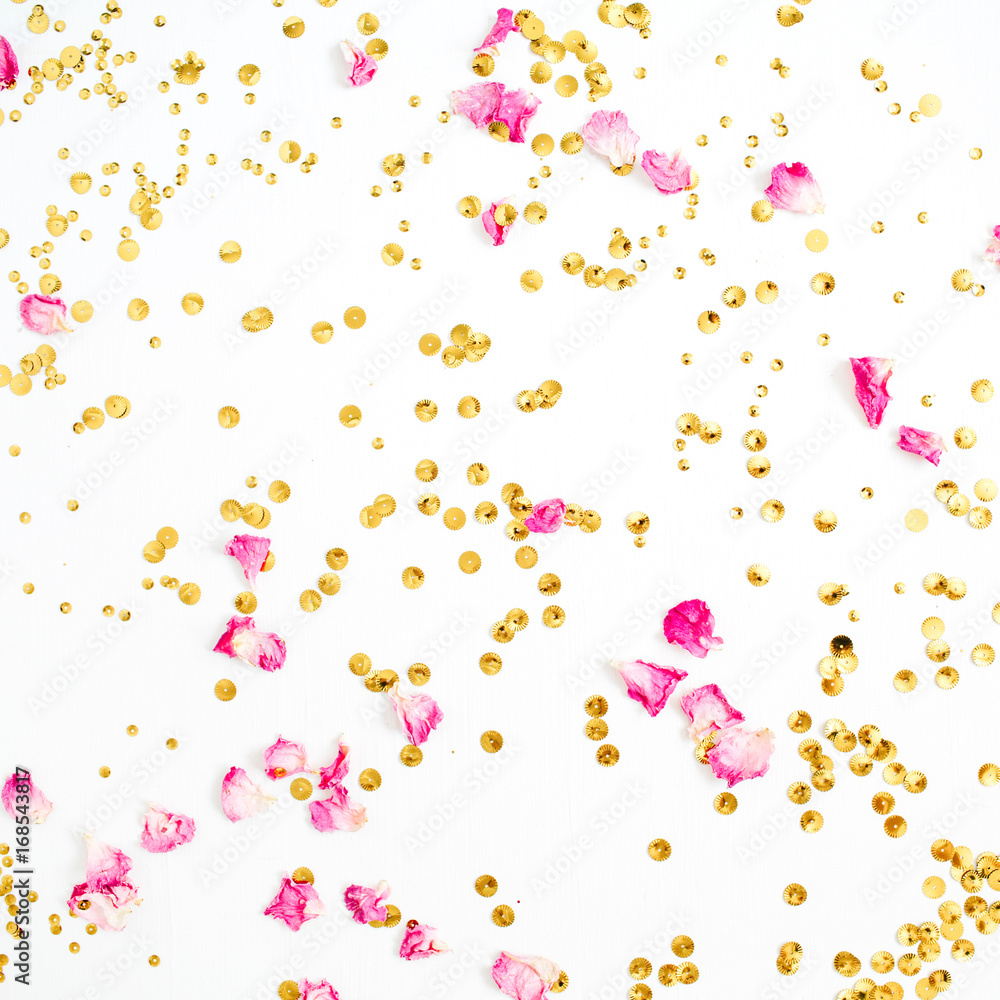 Colorful pattern made of pink rose petals and golden confetti on white background. Flat lay, top view.