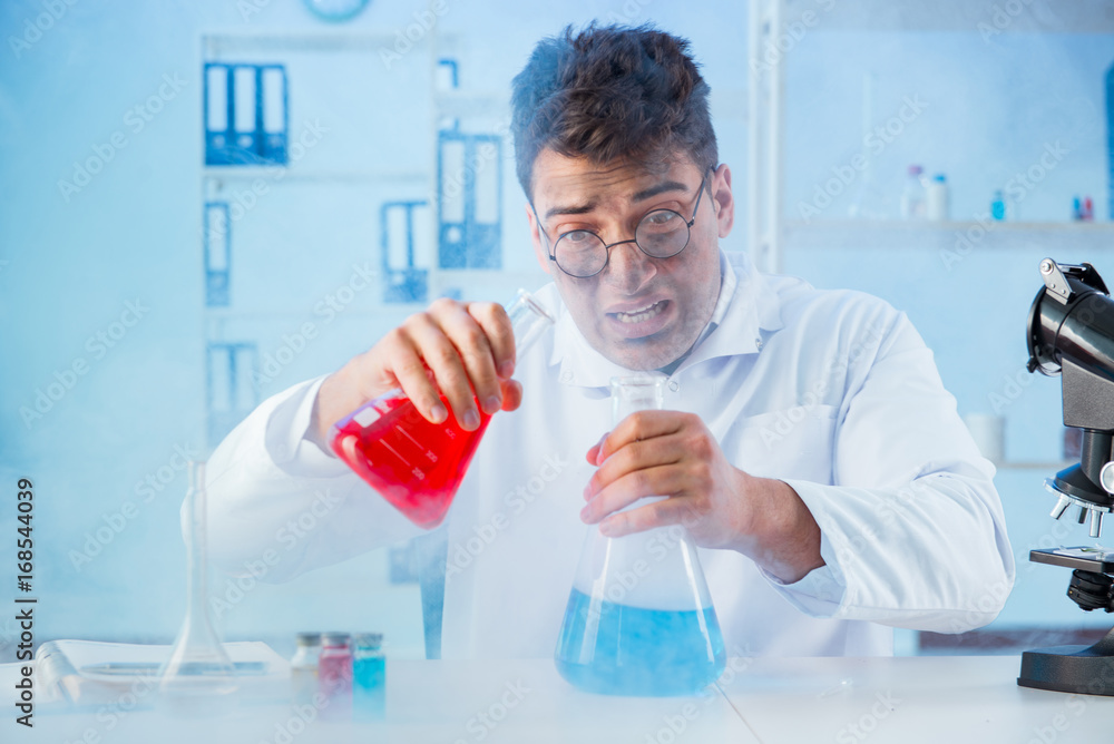 Funny mad chemist working in a laboratory