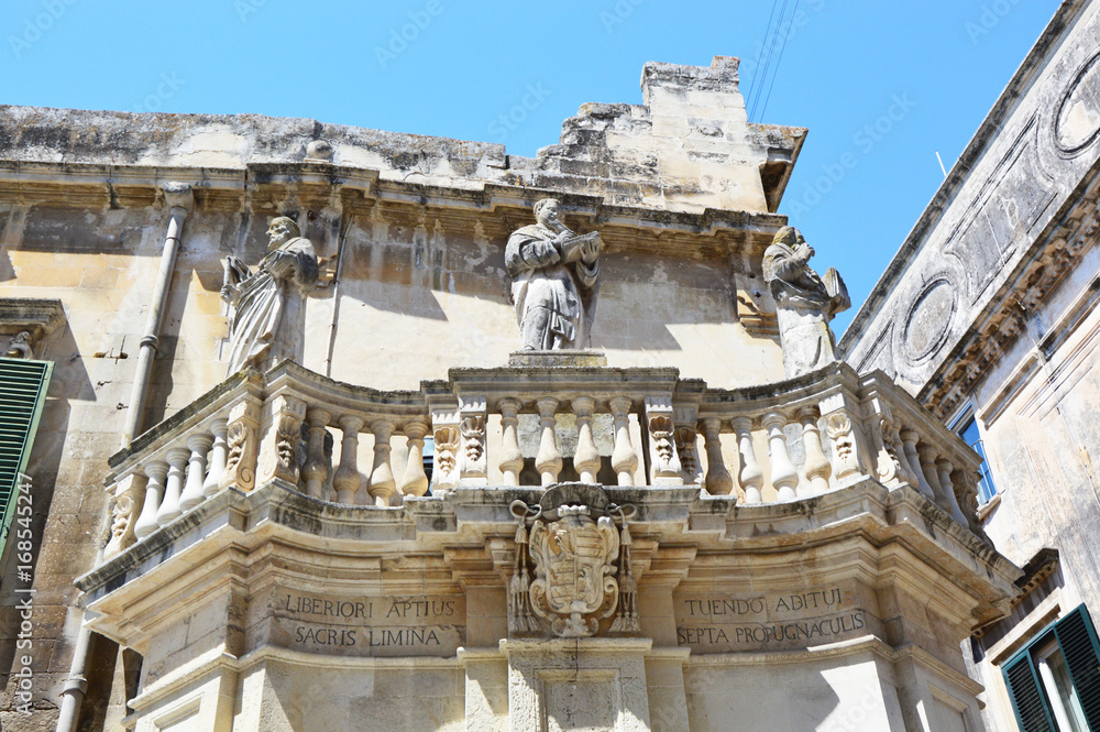Detail balcony with statues in Piazza del Duomo square, Lecce, Italy