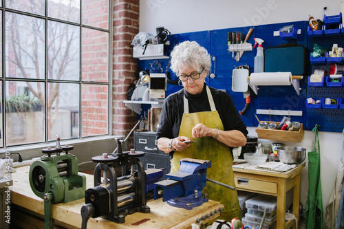 Art Jeweler Working in Studio