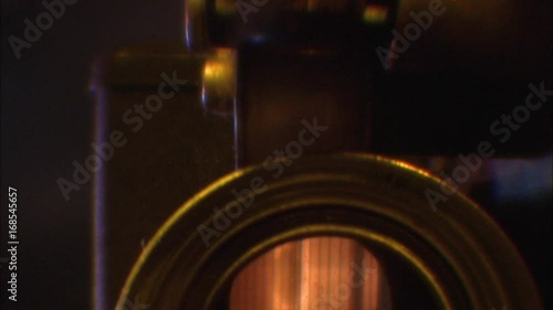 CU of working old motion picture projector.