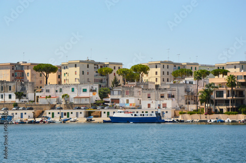 Blue water of Brindisi port with ships, Apulia, Italy