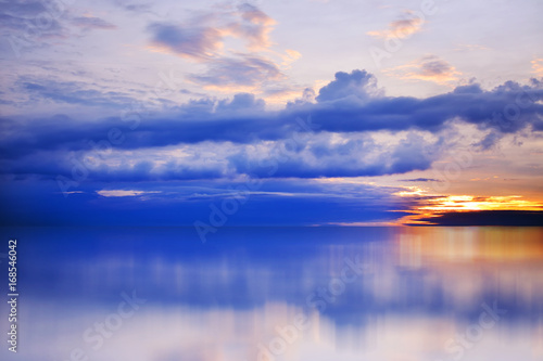 Bright  colorful sunset over the sea  blue sky  rich cloud