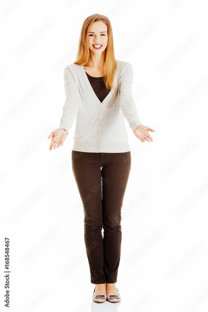 Fototapeta premium Beautiful casual woman is having a copy space on her palms, hand