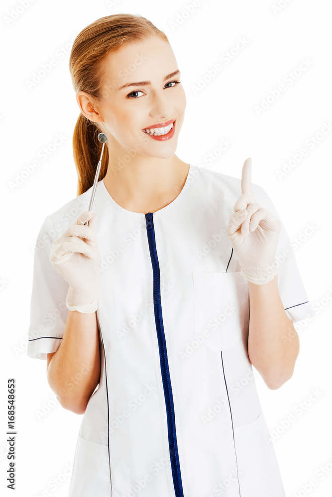 Young beautiful dentist woman with equipment. Young beautiful dentist woman with equipment.