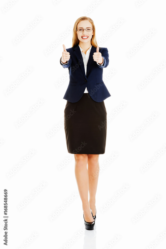Beautiful business woman with her thumb up, showing oK. Beautiful business woman with her thumb up, showing oK.