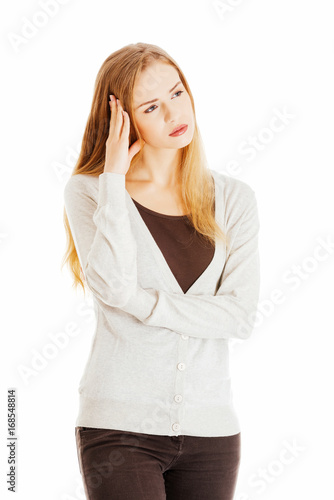 Beautiful casual woman looks worried.