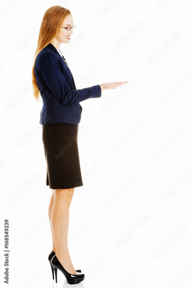 Beautiful business woman with copy space on her hand. Beautiful business woman with copy space on her hand.