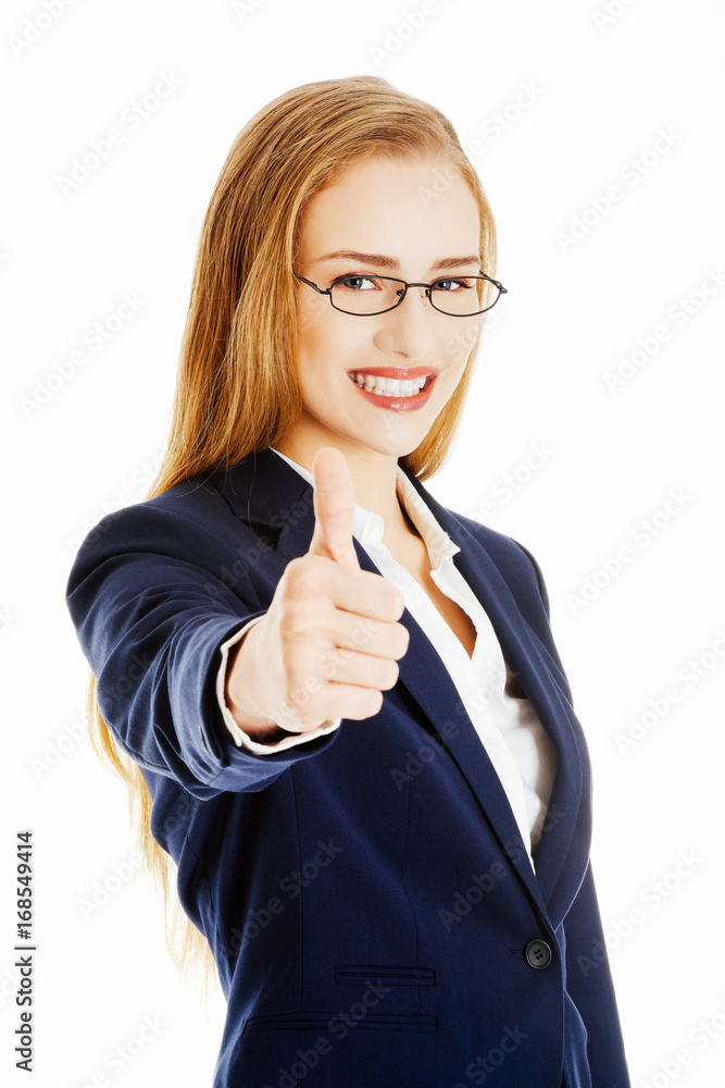 Beautiful business woman with her thumb up, showing oK.