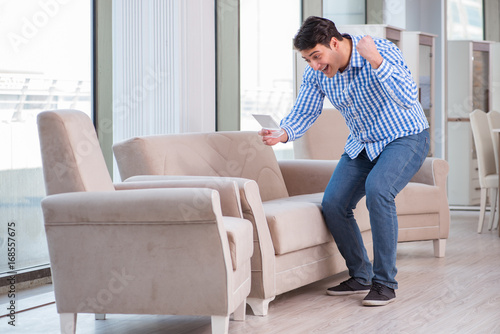 Young man shopping in furniture store © Elnur