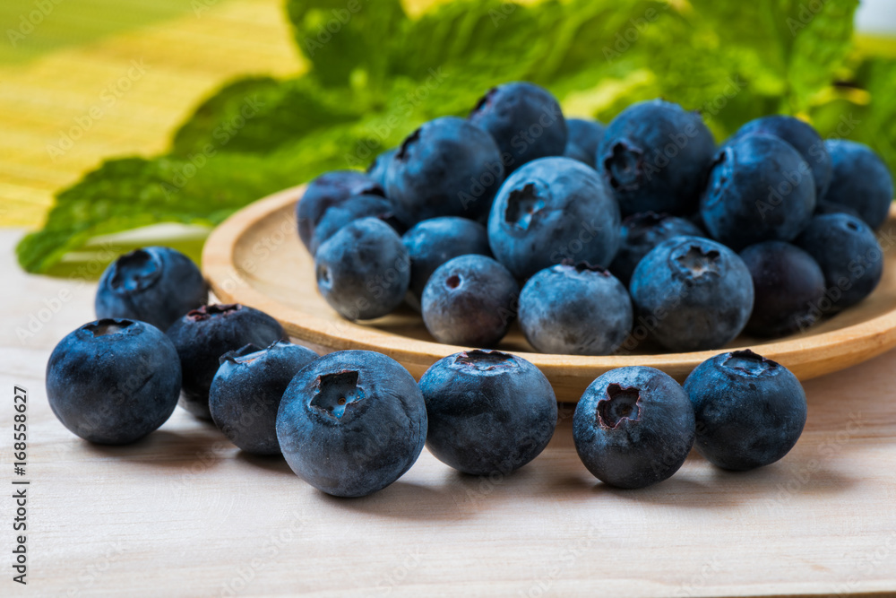 Arrangement blueberries on plank Arrangement blueberries on plank