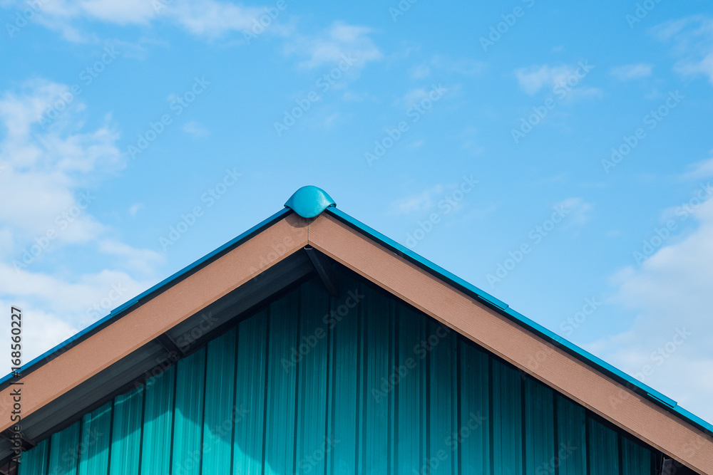 Galvanized sheet (zinc sheet) building and roof with blue sky. Galvanized sheet (zinc sheet) building and roof with blue sky.