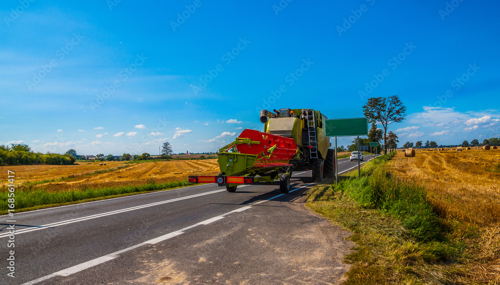 Tractor with a tank for transporting grain Tractor with a tank for transporting grain