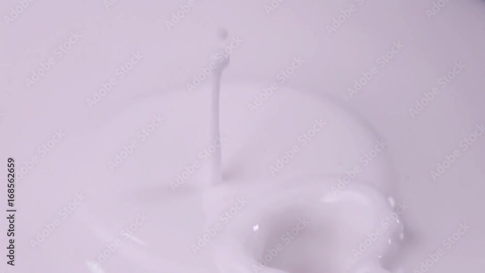 Raspberries falling into milk in slow motion. Raspberry falls into Yogurt in slow motion. Raspberries falling into milk in slow motion. Raspberry falls into Yogurt in slow motion.