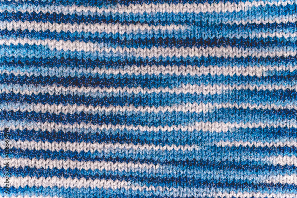 Knitting. Texture of blue knitted fabric Knitting. Texture of blue knitted fabric