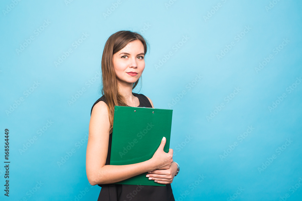 Business Woman Holding A Clip Board on blue background and copy space. Business Woman Holding A Clip Board on blue background and copy space.