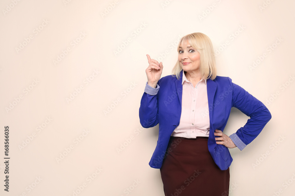 Obraz premium Beautiful senior woman on light background