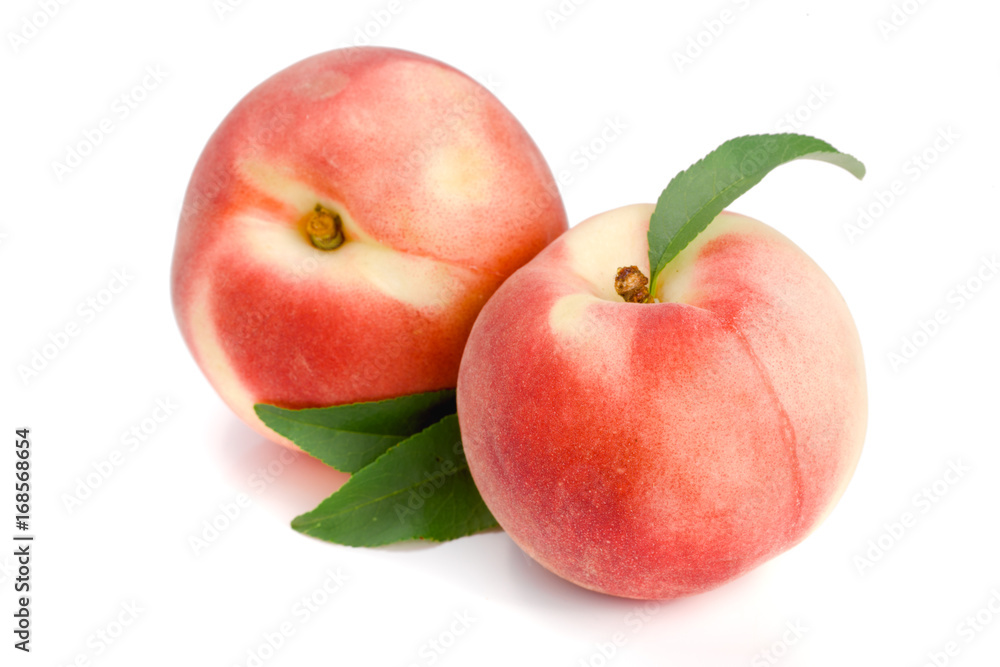 Two peaches with green leaf isolated on white background Two peaches with green leaf isolated on white background