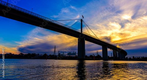 A Silhoutte of the West Gate Bridge in Melbourne Australia with a dramatic sky in the background