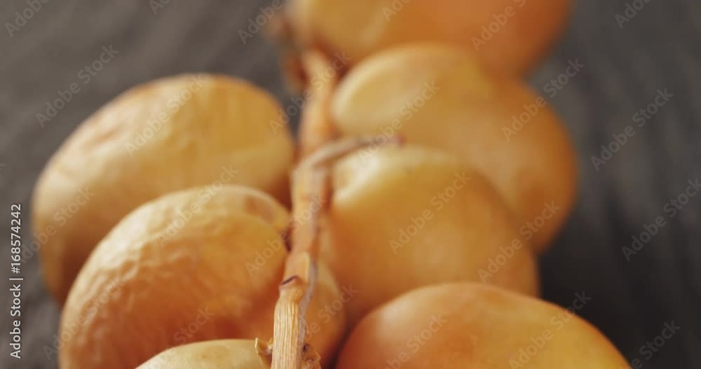 fresh raw dates on table old oak wood fresh raw dates on table old oak wood