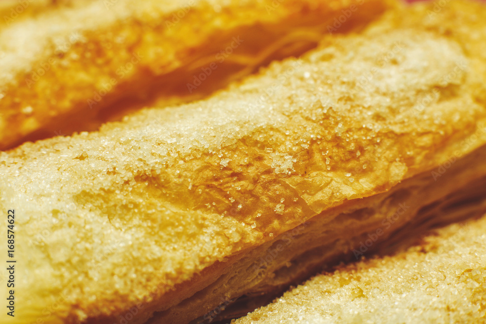 Puff pastry cakes with sugar powder close up Puff pastry cakes with sugar powder close up