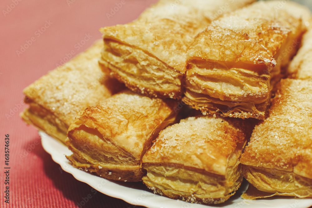 Puff pastry cakes with sugar powder close up Puff pastry cakes with sugar powder close up