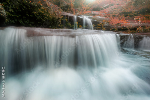 Amazing beautiful waterfall in autumn forest