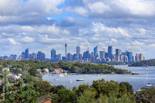A view of Watsons Bay and the distant skycrapers of Sydney' CBD, Water with Yacht, Harbour Bridge and Cityscape in background