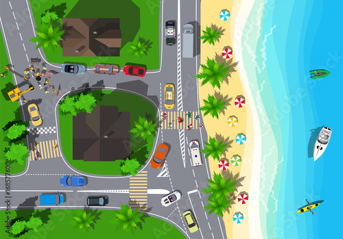 Top view crossroads in a small town. Workers are repairing the road near sea coast