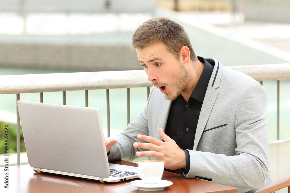 Amazed businessman receiving good news Amazed businessman receiving good news
