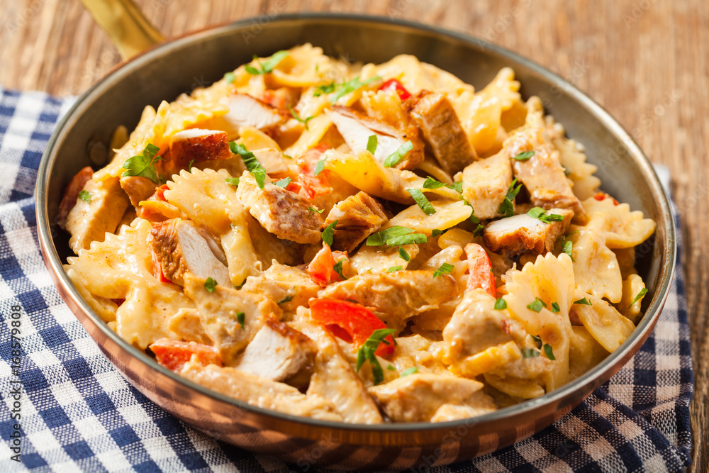 Pasta farfalle with chicken and paprika, in carbonara sauce. Pasta farfalle with chicken and paprika, in carbonara sauce.