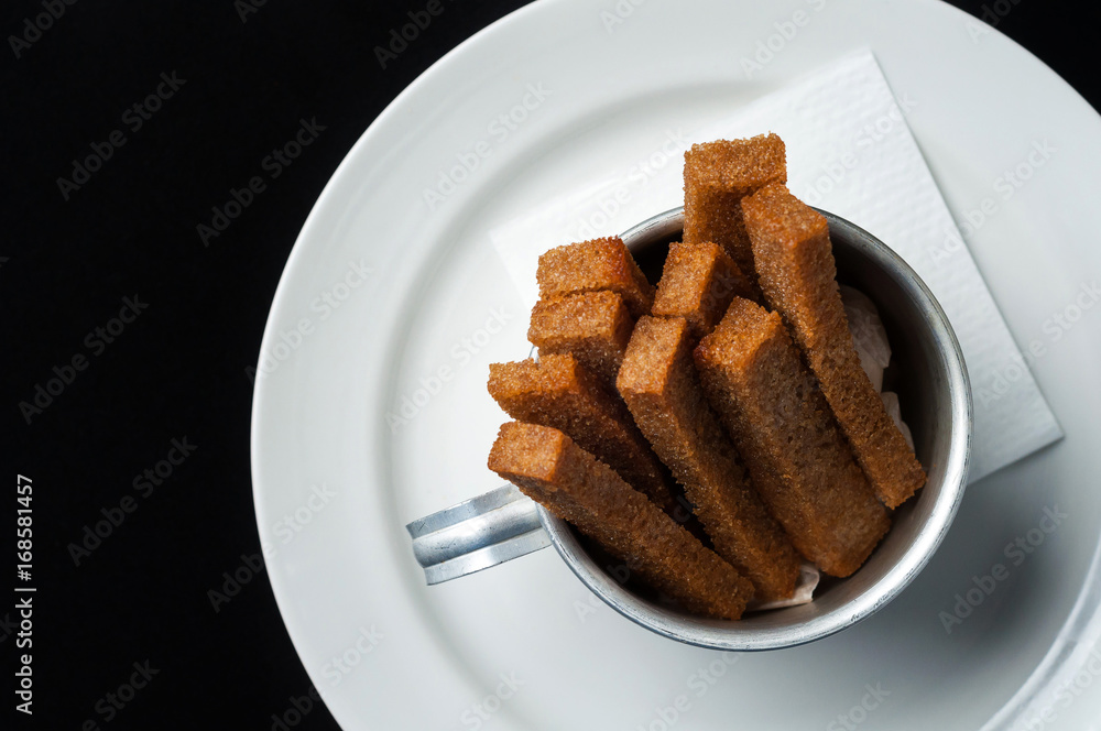 snack to beer on a large wooden plate with the sauce
snack to beer on a large wooden plate with the sauce