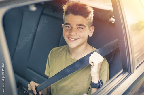 child with seatbelt in the car