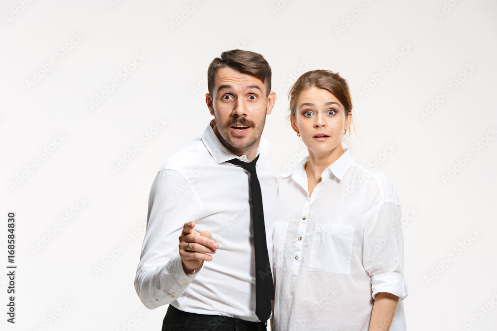 Successful business couple at the office looking at camera Successful business couple at the office looking at camera