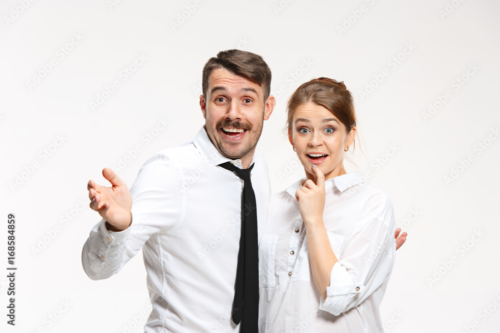 Successful business couple at the office looking at camera Successful business couple at the office looking at camera