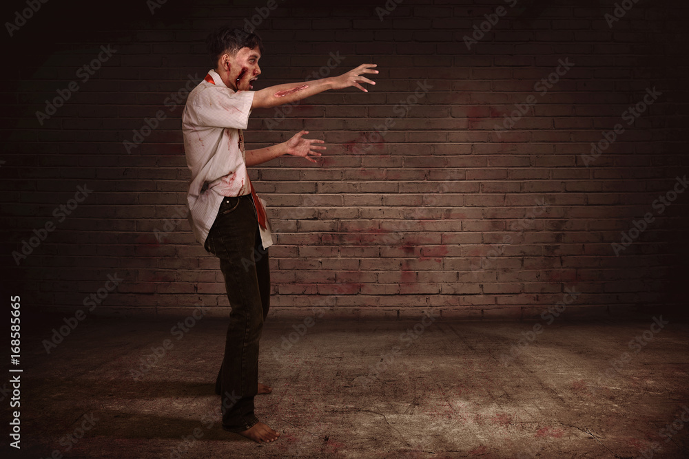 Spooky asian zombie man with claw hand walking Spooky asian zombie man with claw hand walking
