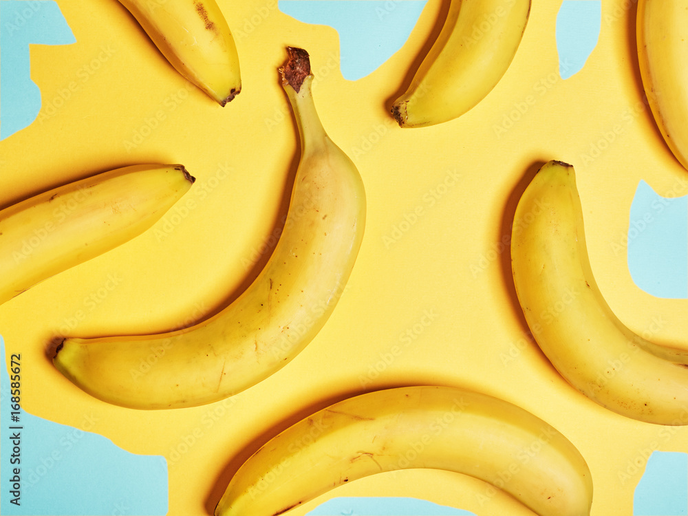 Bananas on an abstract yellow background. Flat lay. Top view Bananas on an abstract yellow background. Flat lay. Top view
