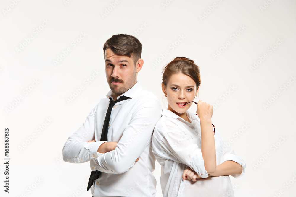 Successful business couple at the office looking at camera Successful business couple at the office looking at camera