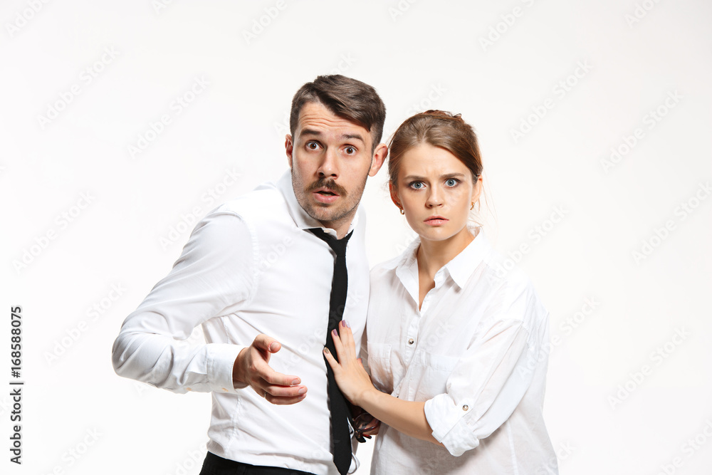 Successful business couple at the office looking at camera Successful business couple at the office looking at camera
