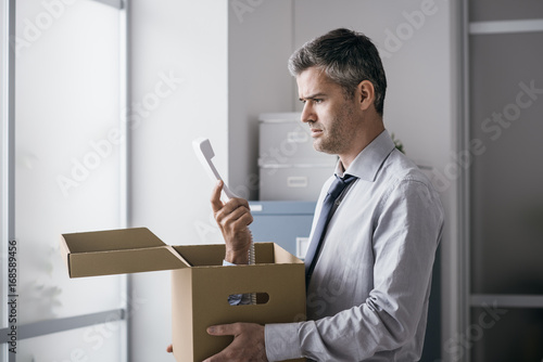 Office worker receiving a surprise call in a box