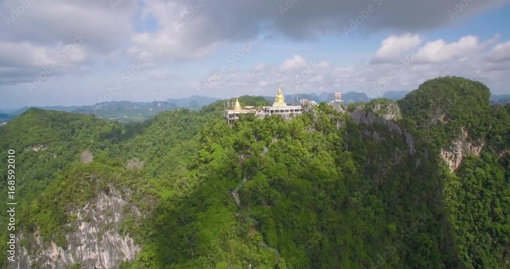 Aerial Approach Shot To Buddha Statue And Stupa On Mountain At Wat Tham Sua, Krabi, Thailand
Aerial Approach Shot To Buddha Statue And Stupa On Mountain At Wat Tham Sua, Krabi, Thailand