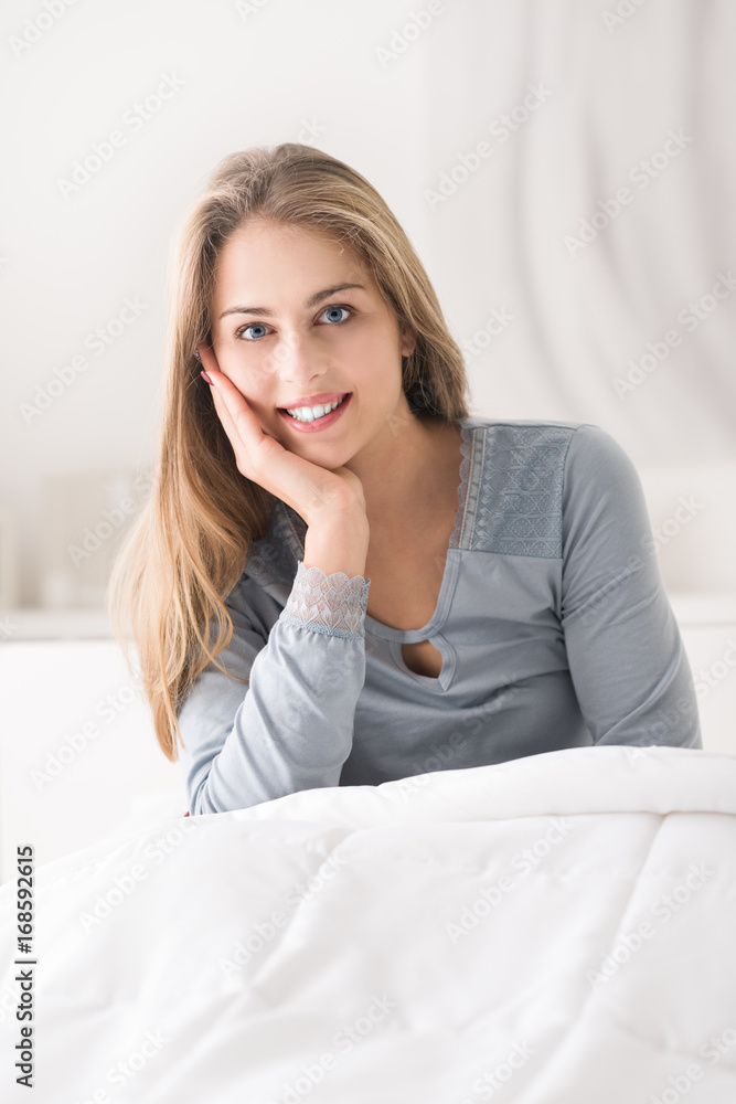 Woman posing in the bedroom Woman posing in the bedroom