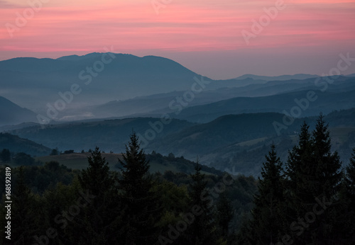 reddish sky at dawn in mountains