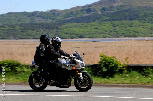 Fototapeta Naklejka Na Ścianę i Meble -  A motorcycle on the open road in Snowdonia, North Wales.