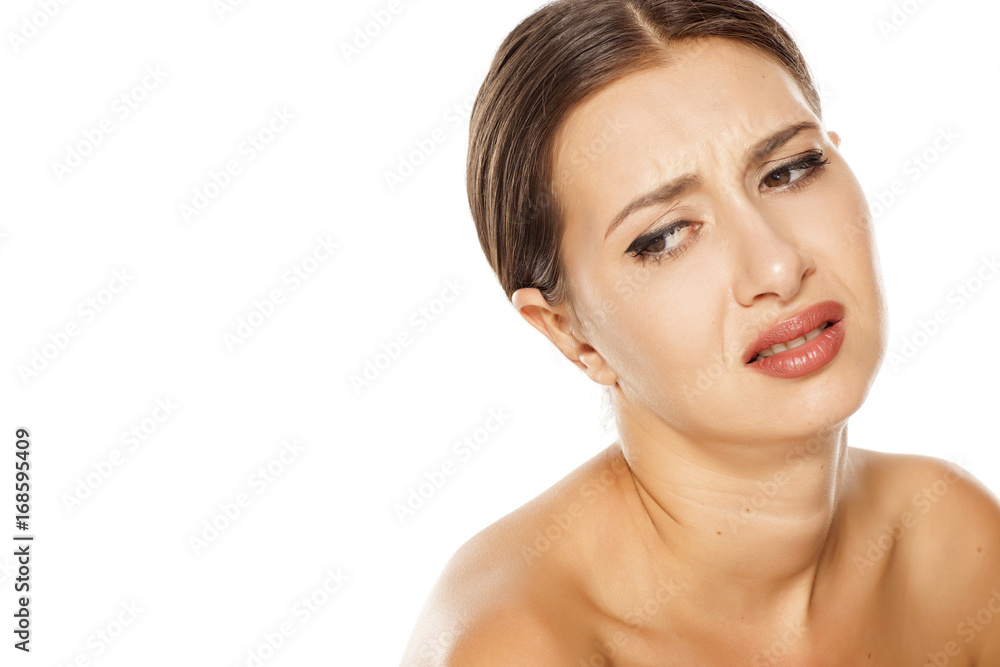 Portrait of sad young woman on white background Portrait of sad young woman on white background