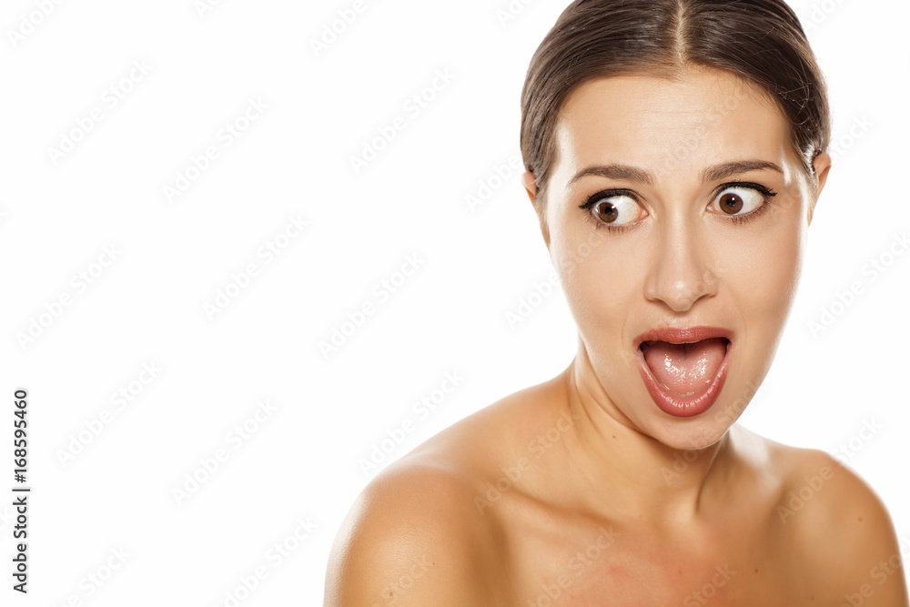 Portrait of shocked young woman on white background Portrait of shocked young woman on white background
